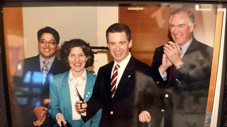 Amit Gupta with Governor Jim McGreevey and other attendees in a group photograph.
